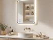 Rounded mirror with LED backlighting in a black aluminum frame